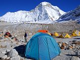 10 26 Baruntse Base Camp With P6770 Behind It took just 85 minutes to descend from the bottom of the West Col to Baruntse Base Camp (5450m). The West Col is on the far left with P6770 in the centre shining in the afternoon sun with my tent at Baruntse Base Camp in the foreground.